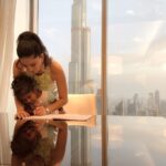 Sunny Leone Instagram - On vacation but I believe in consistency with my daughter. Helping her finish the homework assignment I set for her :) Beautiful Burj Khalifa in the background!! Dubai, United Arab Emirates