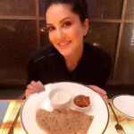 Sunny Leone Instagram – After a long weird day….this is how you cheat! Yum!