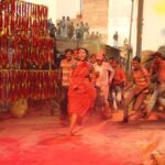 Swara Bhaskar Instagram - These are stills from #raanjhanaa Of the #holi sequence that we filmed in #banaras in the freezing winter of mid-December 2012! Writer #himanshusharma had beautifully written a grand Holi sequence into the screenplay capturing the energy, scale, bhaang-induced madness of Banaras's traditional Holi. It took us 3 days to shoot and the days chosen were 20, 21 and 22 December the COLDEST days of the year. The art department had also constructed a keechad (mud/slush) pool, very thoughtfully filled with warm water which soon turned cold!!! There were almost 200 plus junior artists used for the scene, some of whom were pouring buckets of water from terraces on us while we ran through the streets. I was scared of slipping and thus was barefoot!!! i have NEVER been so cold in my life as i was those three days. But it was the MOST fun i've ever had shooting. It was also the first time in my life that i played Holi in a sari.. The production was very sweet and kept blankets and buckets of hot water ready for us while we waited between shots. Interestingly the writer Himanshu Sharma was missing during the filming of this sequence, he did not come on set as all the actors had sworn to throw him into the keechad pool for writing such a long and vast Holi sequence! :) #throwback #shootlife #RaanjhanaaMemories #6yearsofraanjhanaa