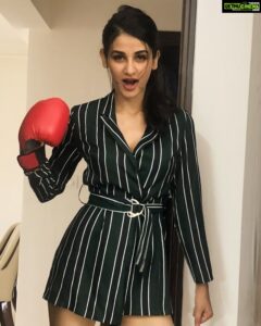 Aditi Arya Instagram - Boxing class right after work means I carry my packed gloves in hand. Don’t worry guys I have my workout outfit in my bag, but doesn’t this take the term “power-suit” to a whole new level? #NotYawning #MyPowerPosesComeWithOpenMouthScreams #UselessHashtagsEdition2