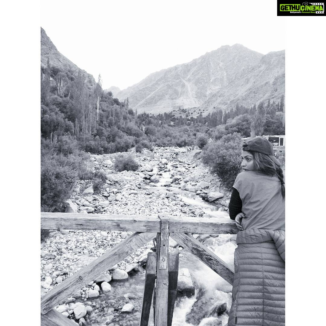 Amala Paul Instagram - THE EDGE OF THE WORLD. That’s exactly what I was thinking when I was standing on this beautiful bridge that separates Turtuk village into two parts Youl and Pharol! No wifi, no network, limited electricity and a distinct local language (Balti), this self-sufficient border village retains the feel of another age! #culture #untouched #unexplored #balticommunity #heavenonearth #turtuk #ladakhdiaries #backpacking #Himalayas #Trek #throwback