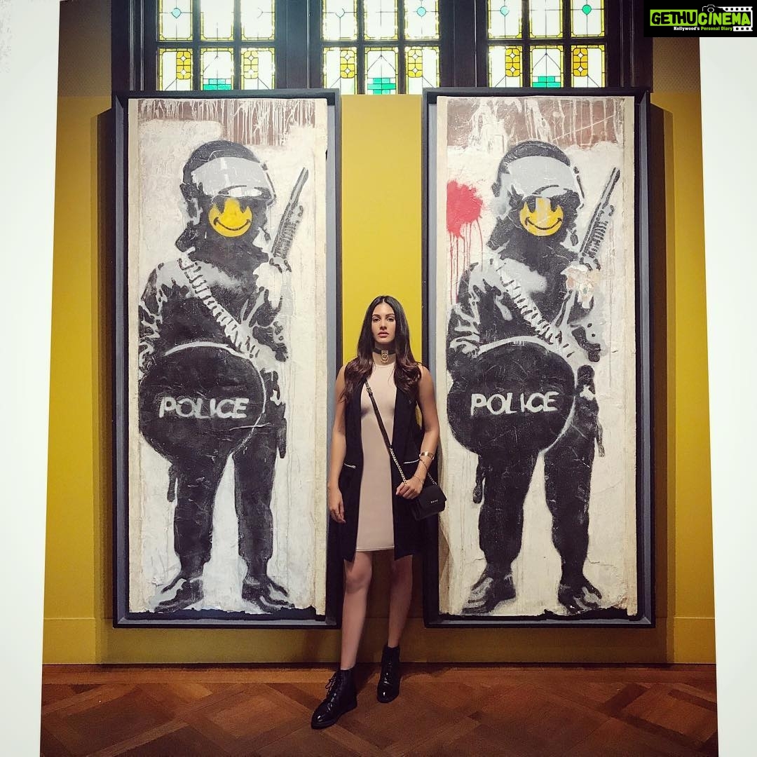 Amyra Dastur Instagram - “In a #world that demands you to obey the wrong rules, being #rebellious is right” - #jennagalbut . . 📸 @riidawg #throwbackthursday #summer #2017 #amsterdam #traveldiaries #nomadlife #wanderlust #banksy #museum Moco Museum Banksy-Roy Lichtenstein