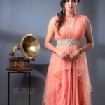 Anjana Rangan Instagram – Peach drape dress from @huesbyanjanaandjeeva 
Photography : @redboxphotography 
MUA : @kalaiartistry 
Hair: @akila_hairstylist