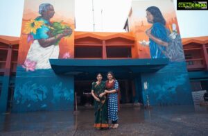 Anu Sithara Instagram - “When passing by this striking mural at the KSRTC bus station in Ernakulam, you can’t help but stop for a moment to really appreciate the thought behind this beautiful artwork. The juxtaposition of an old lady carrying local fruits, vegetables and flowers while the young girl is carrying a school bag is so thought provoking. It immediately reminded me of my own grandmother, the bond we share and all the valuable lessons she has taught me about our land and traditions, while I teach her about modern trends and technologies. It’s a wonderful way to celebrate our traditions while embracing the future. 

 

The mural is part of @asianpaints Donate A Wall initiative in association with @startindia. It is made by graffiti artist ZERO and assistant OneStroke and is featured prominently on the façade of the busy bus station.

 

The picture was clicked keeping in mind all the safety precautions for both me and my grandmother.