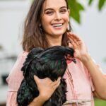 Evelyn Sharma Instagram - Finally did a new photoshoot and of course the chicken escaped… lol 🤦🏻‍♀️ we had to chase it around the yard for half an hour before I finally caught it!! 😅 🐓 #countrylife #australia #desigirl #countrygirl #chickensofinstagram #newphoto #comingsoon