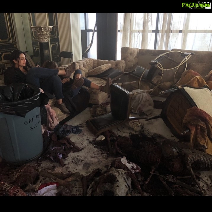 Huma Qureshi Instagram - Me just hanging out on the set of #ArmyOfTheDead waiting to check in at the Zombie Hotel surrounded by zombie entrails.. You know just regular on set Hollywood Glamour #glam #hollywood #hollywoodglamour #bts #throwback .. And that is @ella_purnell aka Kate hidden behind my giant shoe .. This spectacular film is playing on the BIG Screen (select theatres) in the US right NOW!! So everyone in the US watch it now .. and rest of us get to see it on @netflix @netflix_in on the 21st of May #netflix #zombie #zombies
