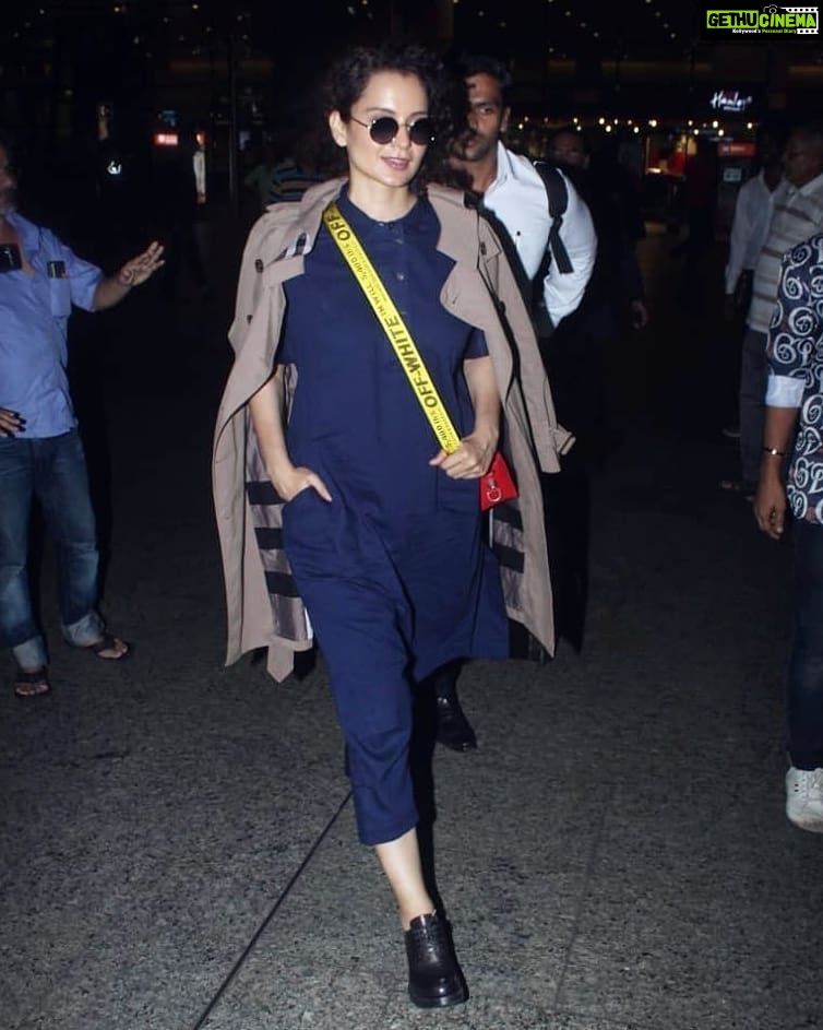 Kangana Ranaut Instagram - #KanganaRanaut returns to Mumbai looking #Dhaakad as ever, giving us all wardrobe goals! . . Dress - @runawaybicycle Trench - @burberry Shoes - @miumiu Sling - @off____white