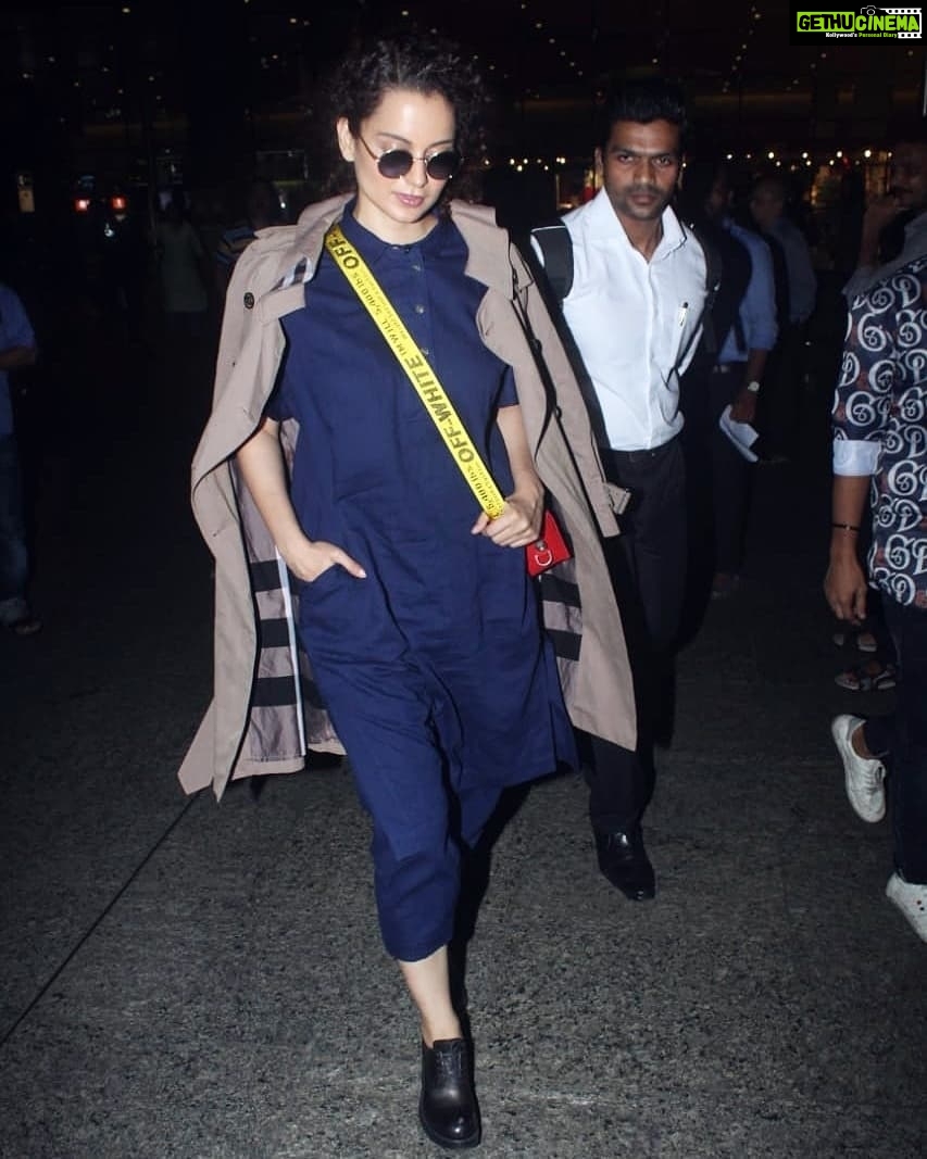 Kangana Ranaut Instagram - #KanganaRanaut returns to Mumbai looking #Dhaakad as ever, giving us all wardrobe goals! . . Dress - @runawaybicycle Trench - @burberry Shoes - @miumiu Sling - @off____white