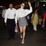 Kangana Ranaut Instagram - 👄👄 CATTITUDE 👄👄 | #kanganaranaut spotted outside the Mumbai airport today 🔥 . . . Shirt: @toteme Skirt: @miumiu Shoes: @dior Bag: @miumiu Shades: @tomford #airportstyle