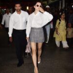 Kangana Ranaut Instagram - 👄👄 CATTITUDE 👄👄 | #kanganaranaut spotted outside the Mumbai airport today 🔥 . . . Shirt: @toteme Skirt: @miumiu Shoes: @dior Bag: @miumiu Shades: @tomford #airportstyle