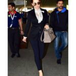 Kangana Ranaut Instagram - Power & Poise! Shirt - @dolcegabbana Cashmere coat- @dolcegabbana Pants - @stellamccartney Shoes- @burberry Bag- @hermes #airportdiaries✈️ #Airportfashion #travelgram #Travelfashion #Manikarnika #Ootd #InstaFashion