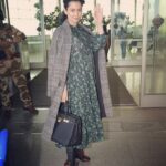 Kangana Ranaut Instagram – Spotted #KanganaRanaut at the airport in what we call a perfect Fall-Winter look. An oversized dress paired with a vintage-inspired duster coat, leather rights and statement boots. 😍😍😍