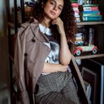 Kangana Ranaut Instagram - Autumn style done right! ✨ Today's uber chic look is a fun combo of a classic trenchcoat over a graphic T-shirt, checkered pants, and suede boots. All set to walk the grand finale at #indiafashionweek 🥰 stay tuned! #lmifwss20 Photo Courtesy: @_sanu313_