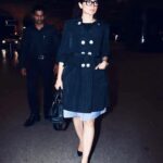 Kangana Ranaut Instagram - From bohemian flower goddess to bawse babe, #KanganaRanaut make an #airportstyle quick change in less than 2 hours, to leave for L.A. for her prosthetic look test for the upcoming Jayalalithaa biopic, 'Thalaivi'. Can't wait to see her in the avatar? Watch this space for more. Credits: Trench - @louisvuitton Skirt - @moschino Top- @miumiu Shoes - @burberry Watch - @chopard Glasses - @tomford Bag - @prada