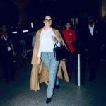 Kangana Ranaut Instagram - BOSS Mode 😎 — Slaying the Airport look with her sharp dress sense!! Here, #KanganaRanaut spotted at the Mumbai Airport where she's taking a flight to Thailand. . . Wardrobe 👗 Shirt: @toteme Pants: @burberry Overcoat: @loewe Shoes: @kurtgeiger Bag: @ysl Watch: @chopard