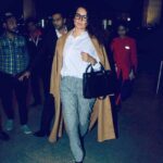 Kangana Ranaut Instagram - BOSS Mode 😎 — Slaying the Airport look with her sharp dress sense!! Here, #KanganaRanaut spotted at the Mumbai Airport where she's taking a flight to Thailand. . . Wardrobe 👗 Shirt: @toteme Pants: @burberry Overcoat: @loewe Shoes: @kurtgeiger Bag: @ysl Watch: @chopard