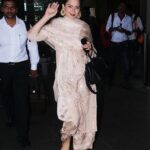 Kangana Ranaut Instagram – This is a gota appreciation post. Gota is crafted using an appliqué technique with a strip of gold or silver or various other coloured ribbons of different widths woven in a satin or twill weave. This age-old and incredible technique is a gift of our incredibly talented craftsmen, who are working day and night to create such wearable art. We at Team Kangana Ranaut love the fact that our Queen believes in supporting fashion that is a celebration of handwork and true craft. Spotted her arriving from Jaipur in what could easily be defined as a truly iconic gota salwar salwar look. 
Fun fact: The suit was sourced locally from the indie stores in Jaipur.
