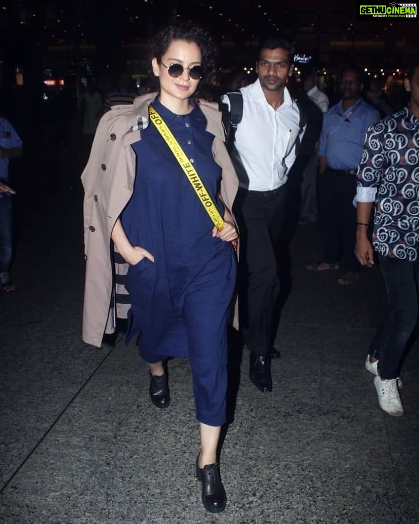 Kangana Ranaut Instagram - #KanganaRanaut returns to Mumbai looking #Dhaakad as ever, giving us all wardrobe goals! . . Dress - @runawaybicycle Trench - @burberry Shoes - @miumiu Sling - @off____white