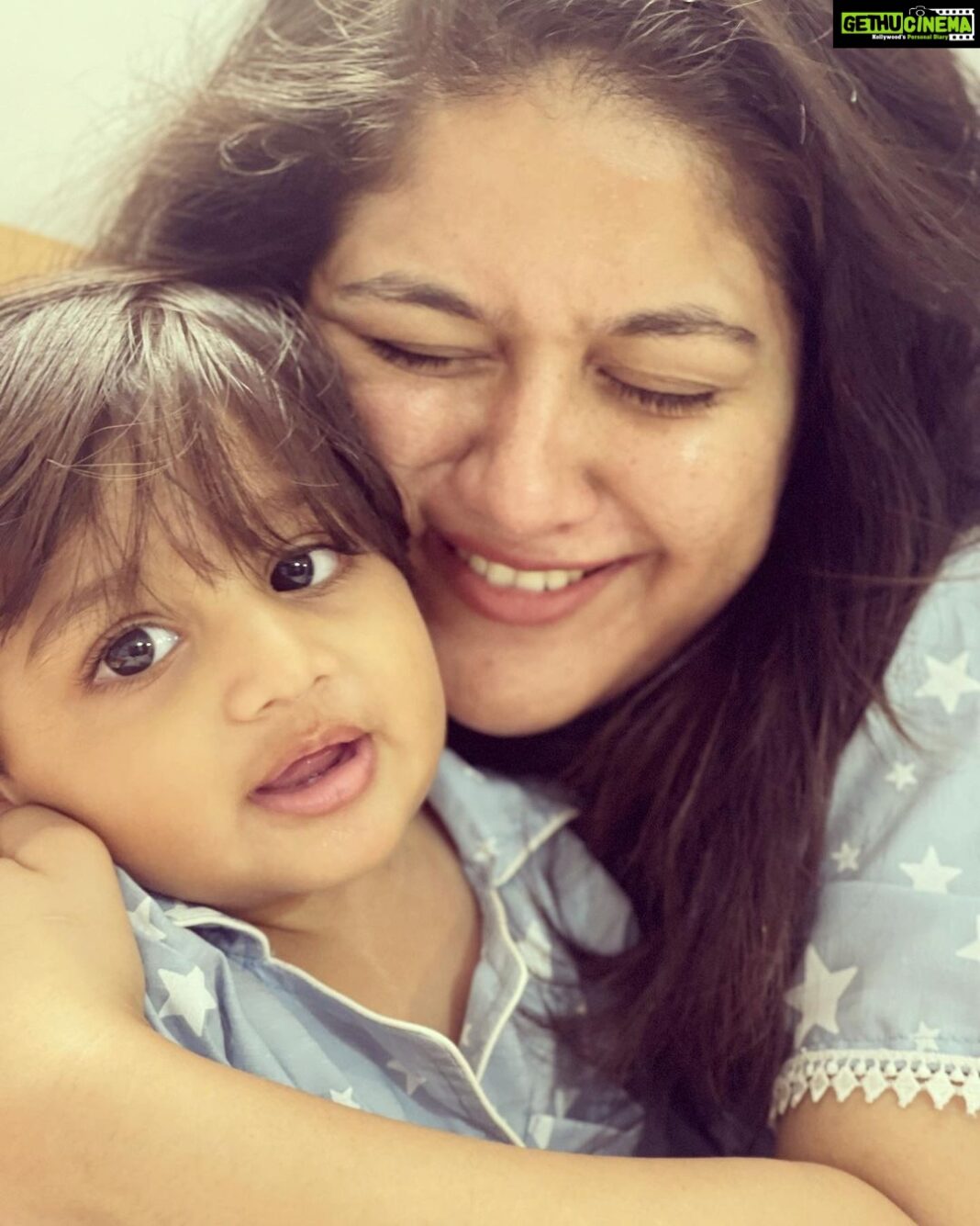 Meghana Raj Instagram - Our baby…. Our world… our universe… our EVERYTHING! CHIRU… our lil prince is ONE YEAR OLD! I will squish him till he says ‘amma stop!’ And continue squishing him till he turns red wid embarrassment! Will smother him wid kisses til he rolls his eyes and says, ‘amma!’ And will continue smothering him witb more kisses! I love u my baby child… ur growing up so so fast!! I wish we cld just lay cuddled in each others arms for all eternity! HAPPY BIRTHDAY RAAYAN! Appa and amma love you! ❤️ @lasya_umesh thank you for this click!!! We love u! @kiddlekiddlle this is definitely very special!