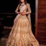 Mouni Roy Instagram - Sun, moon & the stars..✨ संगीत #favsoirée • • • My stunning lehenga by @falgunishanepeacockindia thank you ♥️ Jewellery my fav 🤩 @golecha_jewels Style by my @rishika_devnani Wedding planners : @neferrtitiweddings Decor & styling : @neferrtitiweddings Hospitality partner : @hiltongoaresort Videography team : @theweddingjournalsofindia Photography team : @priyamparikhpictures Hospitality management: @Bgc.event Technical partner : @resonateproblr DJ: @dj_sharath Stationary partner : @puneetguptainvitations Unforgettable memories created by @reemasang @studioneelabh Thank you @thehimanisingh for playing at the after party. Lots of love ♥️ Hilton Goa Resort