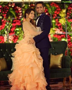 Nakshathra Nagesh Instagram - One month since our big day! 🧿❤️ and more than one year since @sameenasofficial started making this dress for me 🥰
.
.
. 
I walked into @sameenasofficial shortly after my engagement to discuss my wedding blouses and as always, giving her a full life update, talking to her about all other events and what I wish to wear, and casually mentioned to her that I was struggling to find the perfect dress for my reception. It didn’t take her 10 seconds before she said “I’ll make it for you”. The rest is history. Asmitha did everything! From finding a hundred different designs for me to choose from, going up and down several stores to find the perfect colour, buying the entire roll of fabric because she didn’t want anyone else making a dress in the exact same colour (and using it all in my dress because she loves me a little extra), hand embroidered every single element on the dress on the front, the back and the sleeves, keeping me excited through the 100 times we had to postpone the wedding, constantly having me over for trials, helping me out with other aspects of the wedding. She’s been my rock! ❤️ 
.
.
.
Thank you @sameenasofficial for making me wedding looks better than my dream. I am ever so grateful. 
.
.
.
Happy monthiversary to us 🥳
.
.
Dream decor @eventjunctionofficialpage 
Hair @mani_stylist_ 
Groom makeover @chella_hair_makeup 
Glam squad @yesu_thebunny @profile_makeover @sonaldjain25996 
Photography @haran_official_