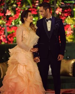 Nakshathra Nagesh Instagram - One month since our big day! 🧿❤️ and more than one year since @sameenasofficial started making this dress for me 🥰
.
.
. 
I walked into @sameenasofficial shortly after my engagement to discuss my wedding blouses and as always, giving her a full life update, talking to her about all other events and what I wish to wear, and casually mentioned to her that I was struggling to find the perfect dress for my reception. It didn’t take her 10 seconds before she said “I’ll make it for you”. The rest is history. Asmitha did everything! From finding a hundred different designs for me to choose from, going up and down several stores to find the perfect colour, buying the entire roll of fabric because she didn’t want anyone else making a dress in the exact same colour (and using it all in my dress because she loves me a little extra), hand embroidered every single element on the dress on the front, the back and the sleeves, keeping me excited through the 100 times we had to postpone the wedding, constantly having me over for trials, helping me out with other aspects of the wedding. She’s been my rock! ❤️ 
.
.
.
Thank you @sameenasofficial for making me wedding looks better than my dream. I am ever so grateful. 
.
.
.
Happy monthiversary to us 🥳
.
.
Dream decor @eventjunctionofficialpage 
Hair @mani_stylist_ 
Groom makeover @chella_hair_makeup 
Glam squad @yesu_thebunny @profile_makeover @sonaldjain25996 
Photography @haran_official_