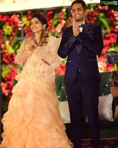 Nakshathra Nagesh Instagram - One month since our big day! 🧿❤️ and more than one year since @sameenasofficial started making this dress for me 🥰
.
.
. 
I walked into @sameenasofficial shortly after my engagement to discuss my wedding blouses and as always, giving her a full life update, talking to her about all other events and what I wish to wear, and casually mentioned to her that I was struggling to find the perfect dress for my reception. It didn’t take her 10 seconds before she said “I’ll make it for you”. The rest is history. Asmitha did everything! From finding a hundred different designs for me to choose from, going up and down several stores to find the perfect colour, buying the entire roll of fabric because she didn’t want anyone else making a dress in the exact same colour (and using it all in my dress because she loves me a little extra), hand embroidered every single element on the dress on the front, the back and the sleeves, keeping me excited through the 100 times we had to postpone the wedding, constantly having me over for trials, helping me out with other aspects of the wedding. She’s been my rock! ❤️ 
.
.
.
Thank you @sameenasofficial for making me wedding looks better than my dream. I am ever so grateful. 
.
.
.
Happy monthiversary to us 🥳
.
.
Dream decor @eventjunctionofficialpage 
Hair @mani_stylist_ 
Groom makeover @chella_hair_makeup 
Glam squad @yesu_thebunny @profile_makeover @sonaldjain25996 
Photography @haran_official_