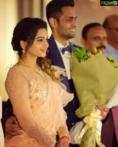 Nakshathra Nagesh Instagram - One month since our big day! 🧿❤️ and more than one year since @sameenasofficial started making this dress for me 🥰
.
.
. 
I walked into @sameenasofficial shortly after my engagement to discuss my wedding blouses and as always, giving her a full life update, talking to her about all other events and what I wish to wear, and casually mentioned to her that I was struggling to find the perfect dress for my reception. It didn’t take her 10 seconds before she said “I’ll make it for you”. The rest is history. Asmitha did everything! From finding a hundred different designs for me to choose from, going up and down several stores to find the perfect colour, buying the entire roll of fabric because she didn’t want anyone else making a dress in the exact same colour (and using it all in my dress because she loves me a little extra), hand embroidered every single element on the dress on the front, the back and the sleeves, keeping me excited through the 100 times we had to postpone the wedding, constantly having me over for trials, helping me out with other aspects of the wedding. She’s been my rock! ❤️ 
.
.
.
Thank you @sameenasofficial for making me wedding looks better than my dream. I am ever so grateful. 
.
.
.
Happy monthiversary to us 🥳
.
.
Dream decor @eventjunctionofficialpage 
Hair @mani_stylist_ 
Groom makeover @chella_hair_makeup 
Glam squad @yesu_thebunny @profile_makeover @sonaldjain25996 
Photography @haran_official_