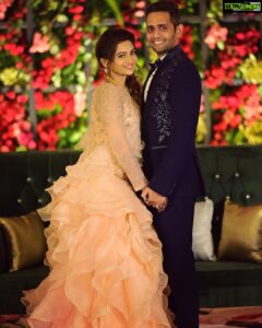 Nakshathra Nagesh Instagram - One month since our big day! 🧿❤️ and more than one year since @sameenasofficial started making this dress for me 🥰
.
.
. 
I walked into @sameenasofficial shortly after my engagement to discuss my wedding blouses and as always, giving her a full life update, talking to her about all other events and what I wish to wear, and casually mentioned to her that I was struggling to find the perfect dress for my reception. It didn’t take her 10 seconds before she said “I’ll make it for you”. The rest is history. Asmitha did everything! From finding a hundred different designs for me to choose from, going up and down several stores to find the perfect colour, buying the entire roll of fabric because she didn’t want anyone else making a dress in the exact same colour (and using it all in my dress because she loves me a little extra), hand embroidered every single element on the dress on the front, the back and the sleeves, keeping me excited through the 100 times we had to postpone the wedding, constantly having me over for trials, helping me out with other aspects of the wedding. She’s been my rock! ❤️ 
.
.
.
Thank you @sameenasofficial for making me wedding looks better than my dream. I am ever so grateful. 
.
.
.
Happy monthiversary to us 🥳
.
.
Dream decor @eventjunctionofficialpage 
Hair @mani_stylist_ 
Groom makeover @chella_hair_makeup 
Glam squad @yesu_thebunny @profile_makeover @sonaldjain25996 
Photography @haran_official_