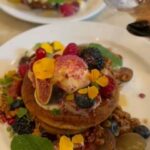 Rashmika Mandanna Instagram - 25 /11/ 21 Dear Diary, this was my 2nd day in Paris.🌸😚 Woke up- worked out- went to this most amazing place for breakfast and I had the gluten-free flower pancake and the French toast 🤤 (see how gorgeous they look) then walked around .. met @tomas_bijoux .. this super amazing gemologist.. and then when to lafayette for some shopping.. 🌸 The only strangers I properly spoke to were these cutest machi machi teddy bears.. 🥲😚🌸 got myself an amazing bubble ice tea 🤤 then got back to the hotel and went out on a cruise.. on a self date.. and had some yum yum food.. and finally, the day had come to an end. 🥰🥰