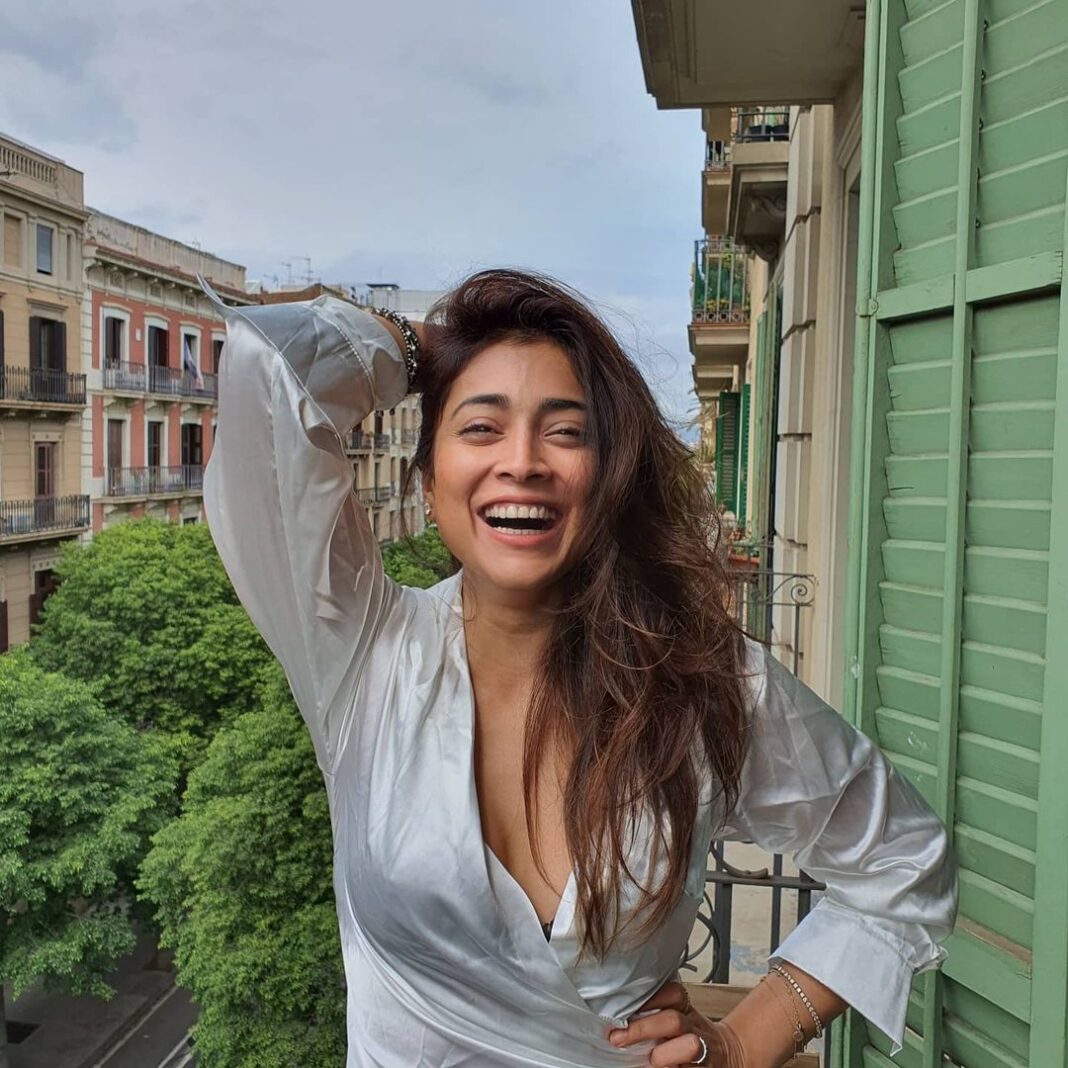 Shriya Saran Instagram - A bit of laughter , from us to you , in these crazy times. May you find happiness with in .... My balcony mornings....