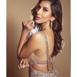 Sophie Choudry Instagram - Stay focused & extra sparkly💥 Felt soooo good to do a gig in this gorgeous @manishmalhotra05 gown🎤🤩 Gown @manishmalhotraworld Earrings @manishmalhotrajewellery HMU @ambereen01 📸 @mayur_butwani #giglife #singer #performer #stagestyle #bling #gown #fashion #styleinspo #ootd #sophiechoudry #manishmalhotra