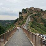 Vidya Balan Instagram - This bridge is the only way to go up from Bagnoregio to the beautiful,scenic,picturesque ghost town (atop the hill) named Civita..hence the name Civita di Bagnoregio. Civita ranks among the 100 endangered sites of the world and has a floating population of 7-100 people in the winter 😶.
