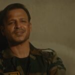 Vivek Oberoi Instagram – “Ek fauji jab jeeta hai to poori shiddat se jeeta hai,
aur jab marta hai to poori izzat se marta hai!”
The battle begins. War on 26th.
Watch the official trailer of #VersesOfWar releasing exclusively this #RepublicDay on #FilmsByFnPmedia
 @vivekoberoi @rohitboseroy @shivaaniirai @prasadkadam87 @vikaasgutgutia @fnpmedia @bhushankumar_dop @kapil000 #girishjohar  #VersesOfWar #indianarmy #jaihind #trailer