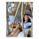 Amrita Rao Instagram - Jus Chillin Like A Villain 🥂 #weekendvibes #chillinlikeavillain 😈 This moment in this cozy swing...truly taking a ChillPill from life... watching the beach.. the waves teasing the sand ...this drink a tinge of JD with Coke ma fav... And there was this laziest dog sleeping in front of my eyes totally soaking the sun giving a damn about the world... This moment stays with me forever.. ...Bohput Beach bliss🍷 Bophut Beach