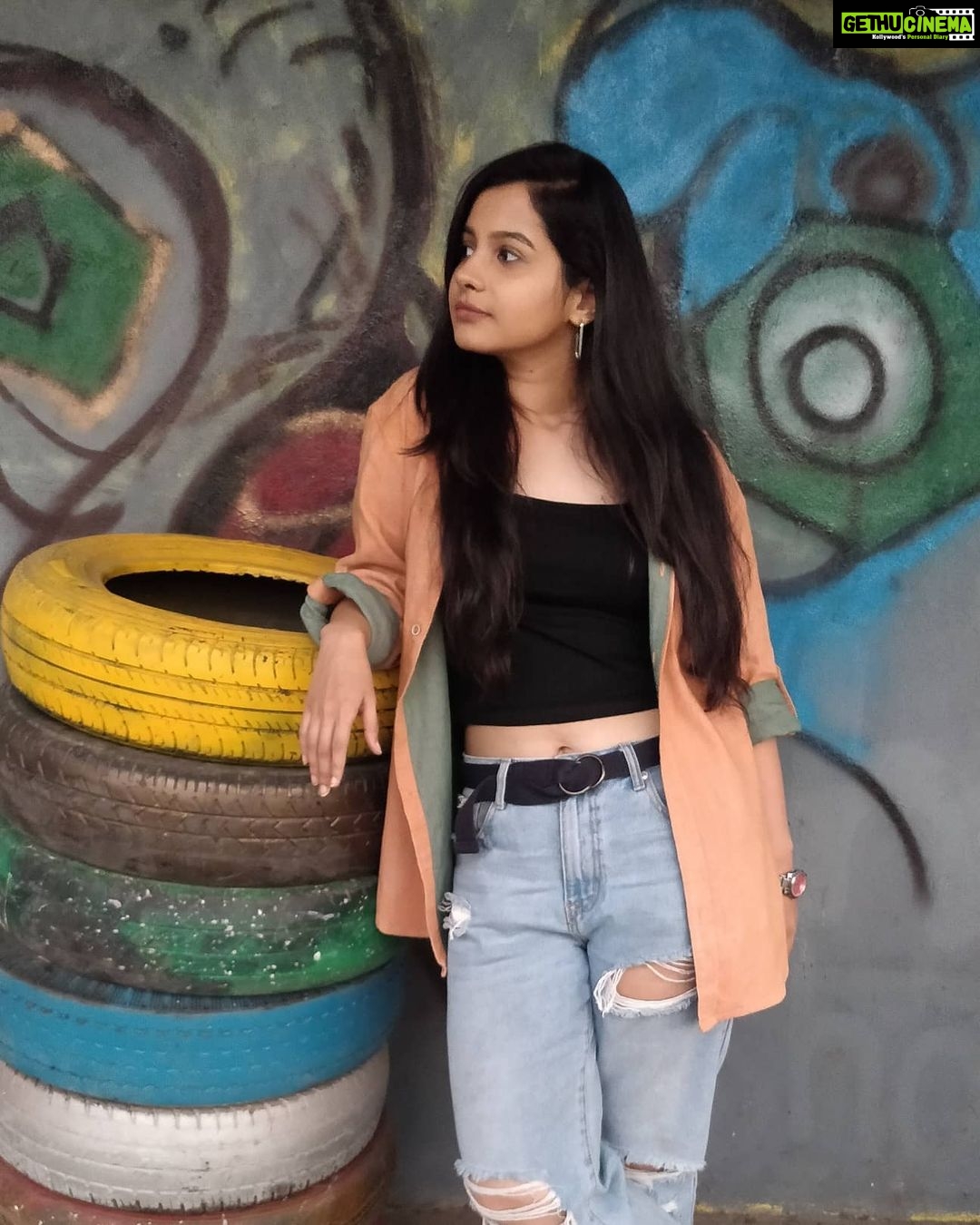 Angana Roy Instagram - Top 'tyre'. π·@ayan.bhattacharjee_ #casuallook #outfitoftoday #wednesdays #rippedjeans #colorsplash #colorpop #top #croptop #croptee #toptier #colorinspo #tyre #tyre #tower #puns #punstagram #backgroundart #artwork #artstudio #captions #aestheticphotography #portrait_vision #casualshirts #hrx #shoes #unedited #noeditnofilter