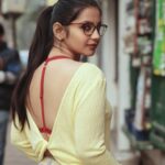 Angana Roy Instagram - Maintaining a little bit of Summer, even in the middle of Winter. 📷@miracle_aligner_ #fridaypost #instamoment #igoftheday #igerskolkata #instapop #instafashion #gram #gramoftheday #kolkataphotography #spec #accessorize #calcuttawalks #whitebelt #calcuttainstagrammers #hairties #streetphotographer #nomakeupmakeuplook #longhairstyles #streetphoto #busystreet #café #cafehopping #yellowaesthetics #arte #jeansfashion #lookingback #backlessblouse #backstory Cafe Bianco