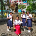 Aparnaa Bajpai Instagram - Shibuya station. This is where Hachiko used to come everyday waiting for his master to return back): And these cute little school girls and I had a few things in common besides our love for Hachiko, so we decided to get clicked together❤️❤️❤️ #hachiko #shibuya #tokyo #japan #traveller #travel #travelstyle #goglocal🌍 #glocalchild Hachiko Statue