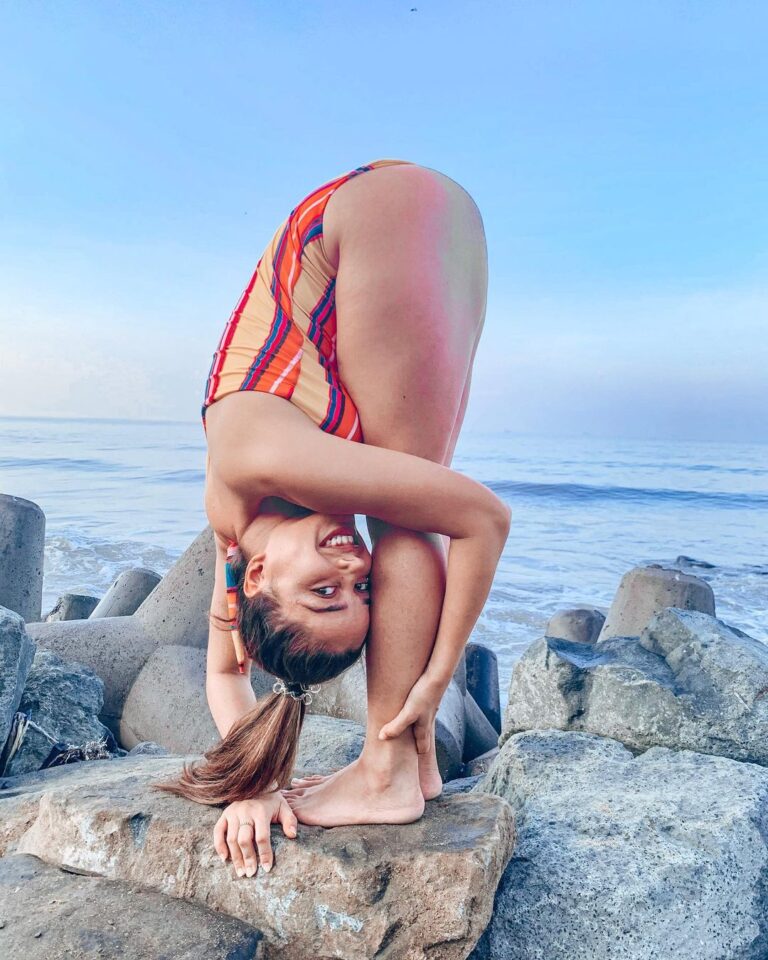 Aparnaa Bajpai Instagram - Uttanasana with a heart full smile❤️ Be a little less serious today & more playful. Less judging & more accepting. Less complaining & more forgiving. Less victimizing & more understanding. Less indifference & more empathy. Less pressure & more care. Less rigid & more loving. Less Me & more We:) #wordsbyaparnaa . . . #yoga #morningyoga #uttanasana #healyoursoul #meditate #yogaistherapy #soul #soulsearching #journey #life #positivevibes #energyhealing #selfreflection #yogini #learner #yogasana #love Somewhere In India
