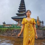 Aparnaa Bajpai Instagram - #Repost @roamingaffair ・・・ Instead of a glorious picture in a wide angle with a majestic temple standing in between the waters, we chose to click this picture, where this spot was left alone by all the tourists. It was more like bees on a honey comb everywhere around where all the tourists came to the temple to pose and click tons of pictures. Not even once I felt the need of being in any of those pictures. Rather, I asked Aadar to keep walking and explore the place which was huge by the way. And then we saw this spot standing alone right in front of the temple wondering why would people not want to come here and if the entry was restricted as this was the main entrance to the temple. Maybe because the tide was low and the water wasn't covering the temple from this side or maybe because everyone wanted the elevated picture of showcasing the temple in between the waters. Whatever it maybe, we preferred walking down the gate and entering the path to the temple and clicking the beauty of this place as it is. Ps: we only clicked a couple of shots and ran back cuz what if the entry was really restricted and we weren't allowed to get in the water.. #ulundanu #bali #knowbali #traveller #blogger #travel #glocalchild #sonyalpha #mytravelstories #shein Ulun Danu Temple-Bali Island-Indonesia