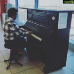 Ashish Vidyarthi Instagram - While awaiting his flight.. A passenger plays... Vaclac Havel Airport Terminal 2