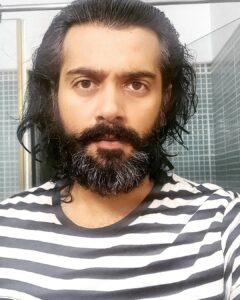 Ashwin Kakumanu Instagram - Decided to give myself some tinkering and polishing today.got fed up of looking like a caveman. Instead of getting food stuck in my beard I can feel the wind. And wife and daughter are thankful as well. :) If anyone's casting for an 70s or 80s period film let me know. I've got the look. #wannaberambo #billandtedlook #anniyan remo #lockdownparithabangal #ponniyinselvan