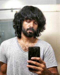 Ashwin Kakumanu Instagram - Decided to give myself some tinkering and polishing today.got fed up of looking like a caveman. Instead of getting food stuck in my beard I can feel the wind. And wife and daughter are thankful as well. :) If anyone's casting for an 70s or 80s period film let me know. I've got the look. #wannaberambo #billandtedlook #anniyan remo #lockdownparithabangal #ponniyinselvan