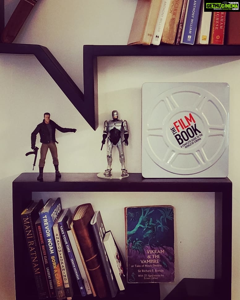 Ashwin Kakumanu Instagram - When I was a kid,anything to do with studying or working was the worst idea possible.As an adult,I always wanted a cool study and work space and finally got it when we moved to our new house. Life comes full circle.Now I just need to read all those books P.S: thank you @gracian.nalin for the cool book on world films as a housewarming gift :) #workhardplayhard #boysandtheirtoys #neca #robocop #terminator