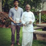 Ashwin Kakumanu Instagram - Piranthanaal Vaazthukkal #isaignaani #illayaraja sir. Got the opportunity to interact with raja sir during my first film as a lead actor, #megha. Will always be a highlight in my career the time I got to observe him and how he worked his magic . After he watched the film to start his background score he walked out of his studio and saw me and said, 'Nalla panirke pa'. Those encouraging words meant the world to me coming from him! His #puthamputhukaalai gave such a platform for me that I'm still recognized as 'Andha kalyaanathla camera vechu suthitiripingalae' by some people (the guy roaming around the wedding with the camera) 😀🖖