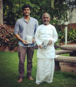 Ashwin Kakumanu Instagram - Piranthanaal Vaazthukkal #isaignaani #illayaraja sir. Got the opportunity to interact with raja sir during my first film as a lead actor, #megha. Will always be a highlight in my career the time I got to observe him and how he worked his magic . After he watched the film to start his background score he walked out of his studio and saw me and said, 'Nalla panirke pa'. Those encouraging words meant the world to me coming from him! His #puthamputhukaalai gave such a platform for me that I'm still recognized as 'Andha kalyaanathla camera vechu suthitiripingalae' by some people (the guy roaming around the wedding with the camera) 😀🖖