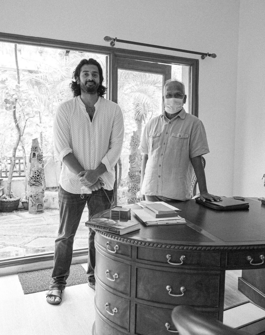 Ashwin Kakumanu Instagram - A special moment for me in my career. Got to take this photo with Mr. Mani Ratnam after I finished dubbing for my portions in #PonniyinSelvan. From meeting him in his office 12 years ago to auditioning multiple times for different projects to being selected and working on this film, it's been a ride. 🔥 * * * P.S: That's my copy of @baradwajrangan book on his table that I took to get autographed. #ponniyinselvan #Manisir #Madrastalkies