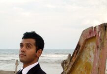Ashwin Kakumanu Instagram - Clean up good. My first portfolio from 2008. Rockin 'The Rock' sideburns that I used to love so much. Shot by my partner in crime and time @sonalimanavalan #lifesabeach #portfolio #actor