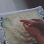 Chandra Lakshman Instagram - Vidyarambam tradition done right.. Appa making me write ll Hari Shri ll on rice is something I always look forward to every year.. 💖 #moongirl #appaponnu #daddysgirl #tradition #stayblessed