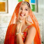 Eshanya Maheshwari Instagram - भोली सी सूरत आँखों में मस्ती दूर खड़ी शर्माए, एक झलक दिखलाये कभी कभी आँचल में छुप जाये....✨ . . Outfit- @shivaliahmedabad Styled by- @riyabhatu_ Photography- @ajpictography Venue- @udai_kothi . . #bride #desigirl #bridal #lehnga #udaipur #esshanya #ootd #photooftheday #fashionblogger #styleblogger #fashioninsta #ad Udai Kothi